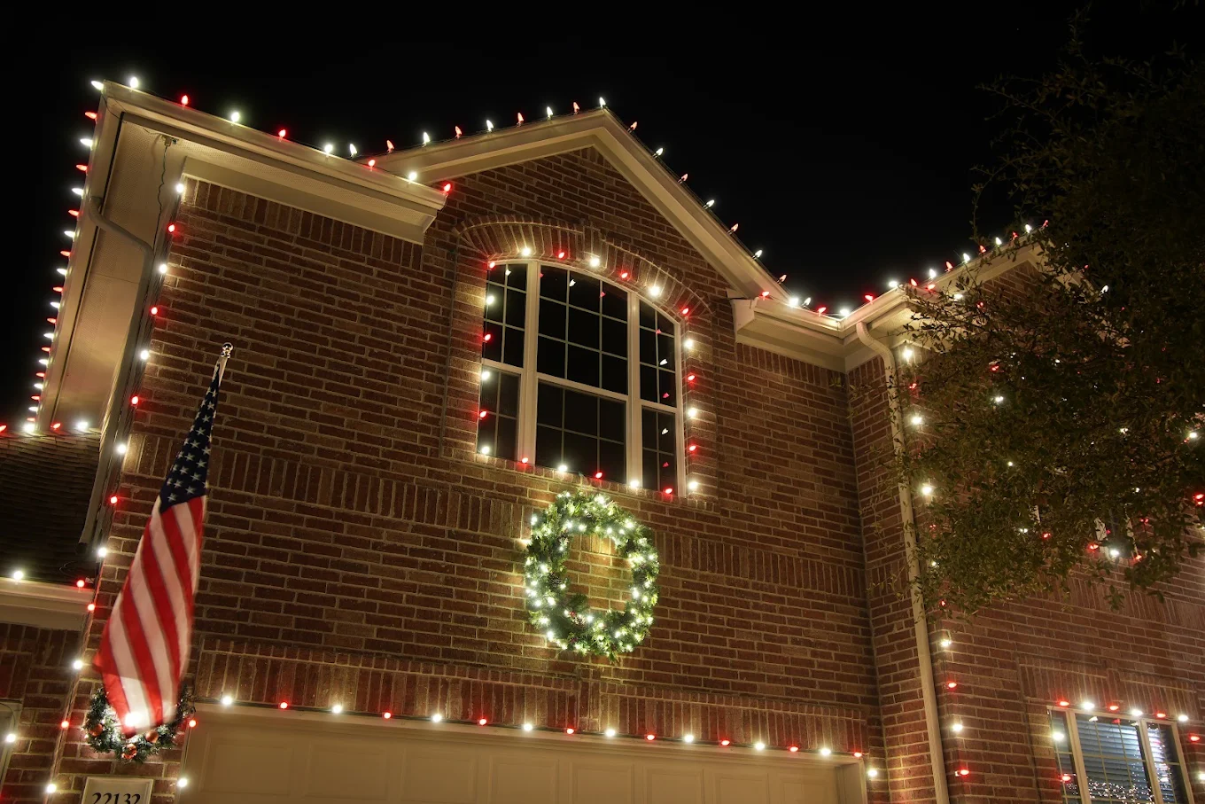 Close-up of custom-fit roofline clips and warm white lighting